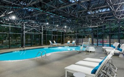 Indoor pool surrounded with loungers at Westin Atlanta Airport Hotel.