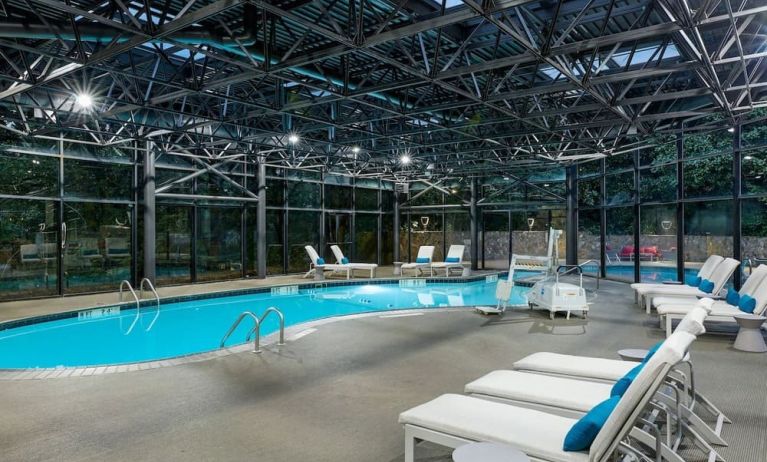 Indoor pool surrounded with loungers at Westin Atlanta Airport Hotel.