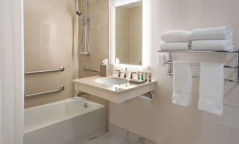 Guest bathroom with shower and tub  at Westin Atlanta Airport Hotel.