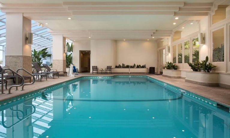 Relaxing indoor pool at Embassy Suites by Hilton San Francisco Airport.