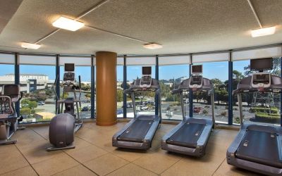 Fitness center with a view at Embassy Suites by Hilton San Francisco Airport.