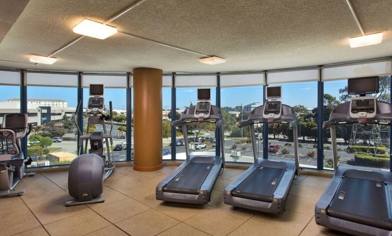 Fitness center with a view at Embassy Suites by Hilton San Francisco Airport.