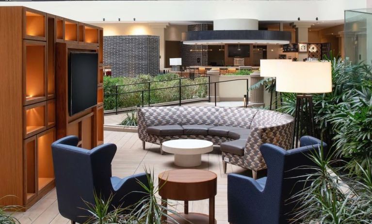 Elegant coworking area in the hotel lobby of the Embassy Suites by Hilton San Francisco Airport.