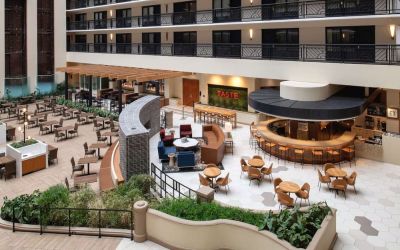 Spacious dining and lounge area perfect for coworking at Embassy Suites by Hilton San Francisco Airport.