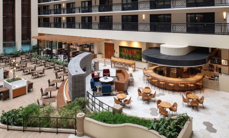 Spacious dining and lounge area perfect for coworking at Embassy Suites by Hilton San Francisco Airport.