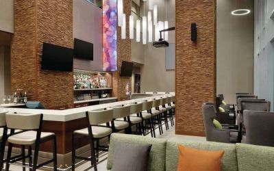 Hotel bar with ample seats at Hilton Garden Inn Calgary Downtown.