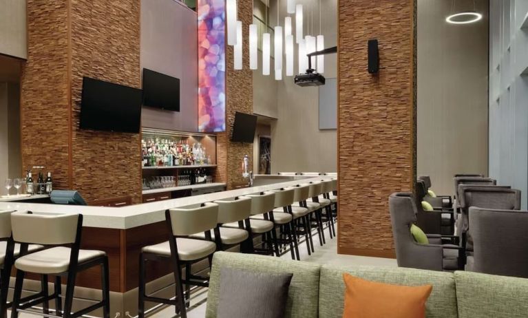 Hotel bar with ample seats at Hilton Garden Inn Calgary Downtown.