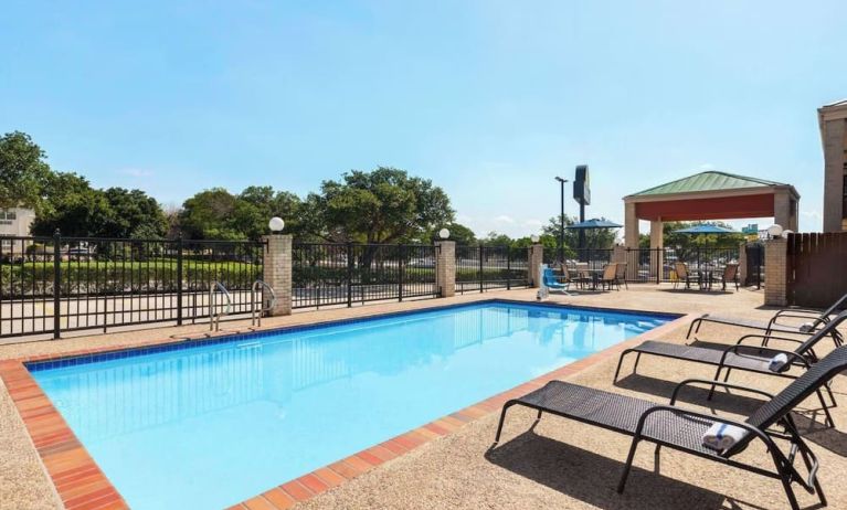 Outdoor pool at Days Inn By Wyndham San Antonio Near Fiesta Park.