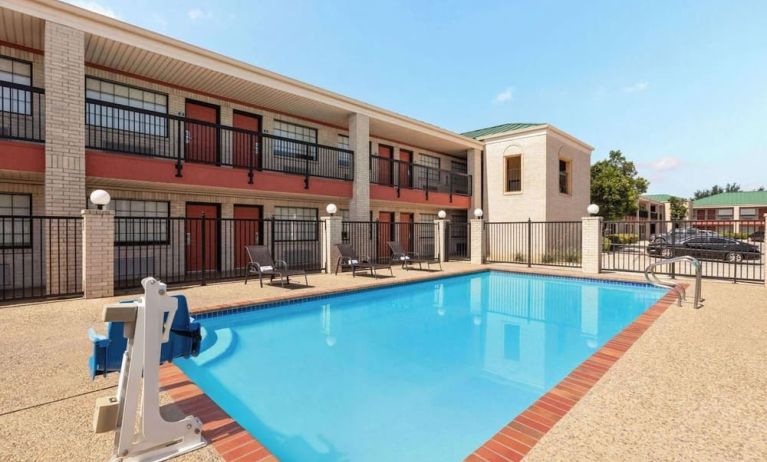 Outdoor pool at Days Inn By Wyndham San Antonio Near Fiesta Park.