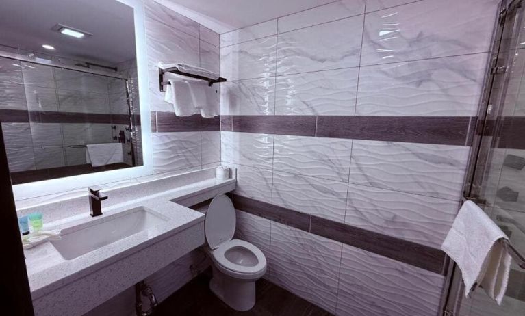 Private bathroom at THE VINE HOTEL BRONX.