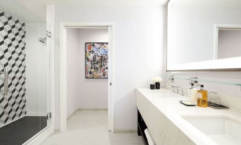 Private guest bathroom with shower and free toiletries at Montrose At Beverly Hills.