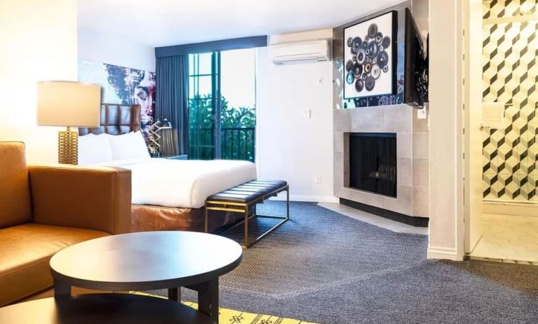 Day use suite with living room and fireplace at Montrose At Beverly Hills.