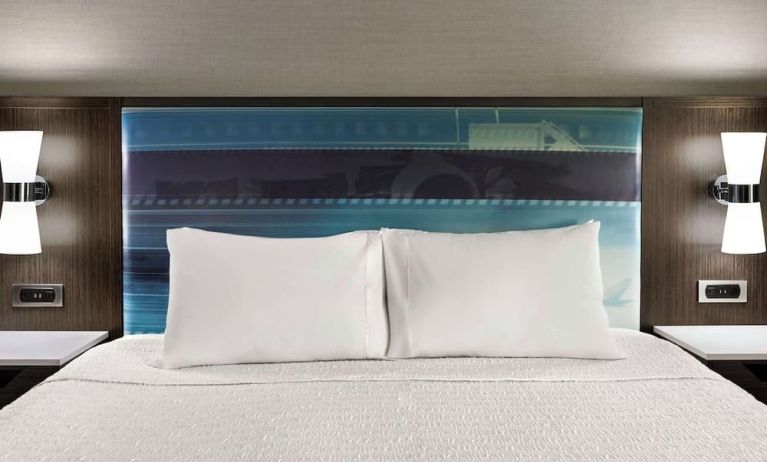 Comfortable king bed at Hampton Inn Chicago-O'Hare International Airport.