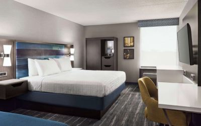 Day use room with work desk, private bathroom and natural light at Hampton Inn Chicago-O'Hare International Airport.