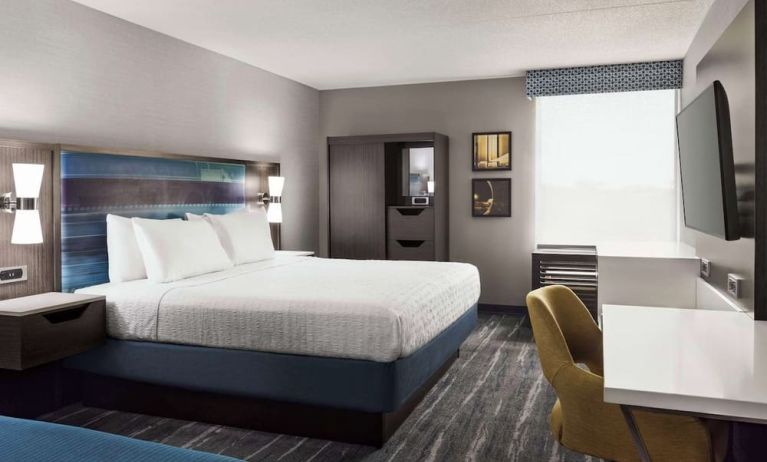 Day use room with work desk, private bathroom and natural light at Hampton Inn Chicago-O'Hare International Airport.
