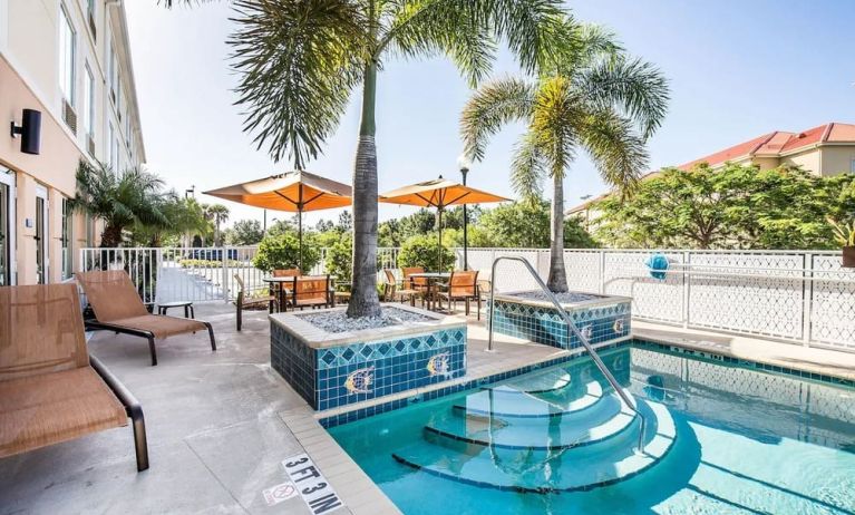 Outdoor pool at Sleep Inn & Suites Port Charlotte - Punta Gorda.