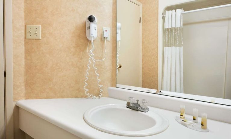 Guest bathroom at Days Inn By Wyndham Brantford.