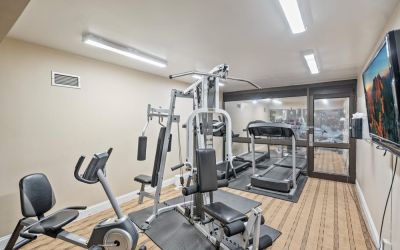 Fitness center at Coratel Plus Suites Wichita West Airport.