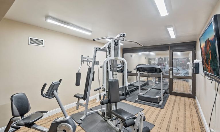 Fitness center at Coratel Plus Suites Wichita West Airport.