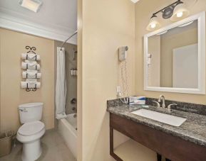 Guest bathroom at Lemon Tree Hotel & Suites Anaheim.