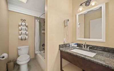 Guest bathroom at Lemon Tree Hotel & Suites Anaheim.