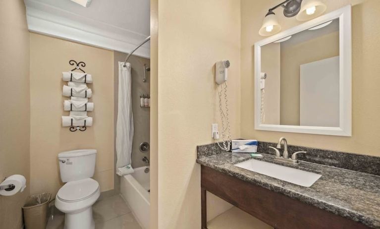 Guest bathroom at Lemon Tree Hotel & Suites Anaheim.