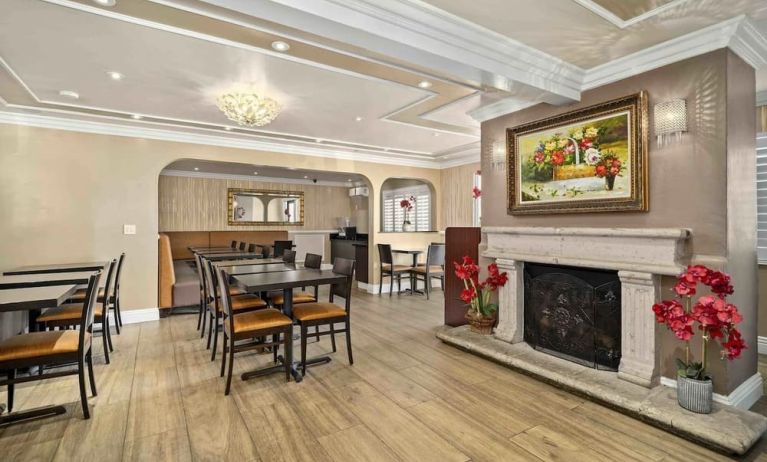 Lobby seating and restaurant at Lemon Tree Hotel & Suites Anaheim.