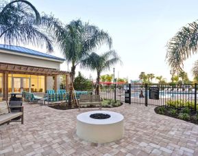 Outdoor terrace at Homewood Suites By Hilton Orlando Theme Parks.