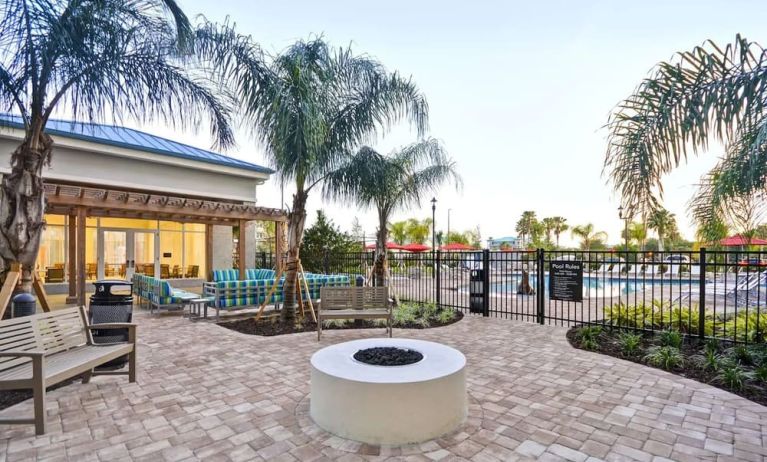 Outdoor terrace at Homewood Suites By Hilton Orlando Theme Parks.