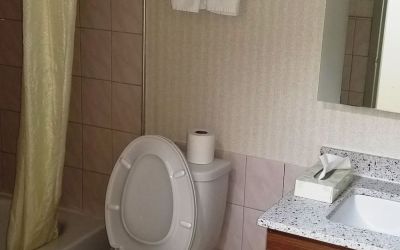 Guest bathroom at Baymont By Wyndham Montreal Airport.