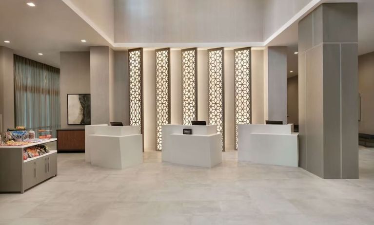 Reception desk at Embassy Suites By Hilton Atlanta Midtown.