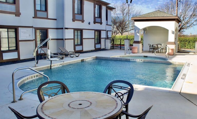 Outdoor pool at Quality Inn & Suites Irving DFW Airport South.