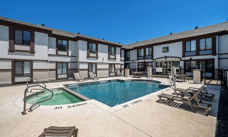 Outdoor pool at Quality Inn & Suites Irving DFW Airport South.