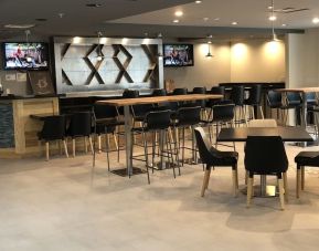 Bar and dining area at Radisson Hotel Atlanta Airport.