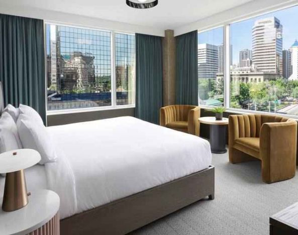 King room with corner city view at the Westley Calgary Downtown, Tapestry Collection by Hilton.