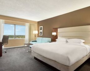 Oversized king room with sofa bed, dining and living Area at the DoubleTree by Hilton Orlando Downtown.