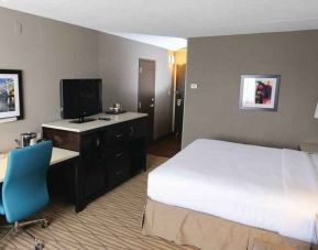 Beautiful workspace with king size bed, desk and TV screen at the DoubleTree by Hilton Cleveland Westlake.
