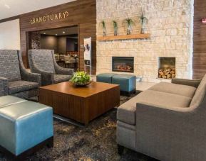 Elegant lounge area with sofa and chairs at the DoubleTree by Hilton Cleveland Westlake.
