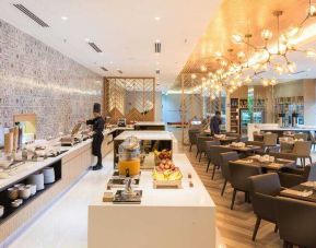 Elegant restaurant area with buffet at the Hilton Garden Inn Kuala Lumpur Jalan Tuanku Abdul Rahman North.