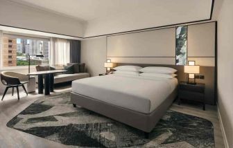 King size bed in a deluxe room with great city view at the Hilton Singapore Orchard.