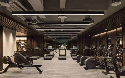Stylish fitness center with treadmills and excercise bikes at the Hilton Singapore Orchard.