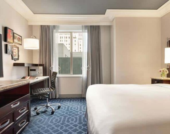 King suite with a dedicated workstation and view of downtown Los Angeles.