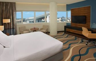 King size bed with 42 inch tv, minibar, and bathroom