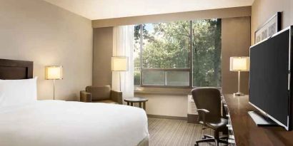 Comfortable deluxe queen room with window view at the Double Tree Toronto Airport West.
