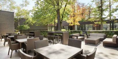 Beautiful workspace with plants and comfortable seating at the Double Tree Toronto Airport West.