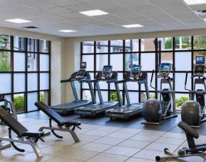 Fitness center with treadmills and weights at the Embassy Suites by Hilton Orlando-Downtown.