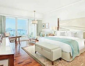 Bright and comfortable king room with sea view at the Waldorf Astoria Dubai Palm Jumeirah.
