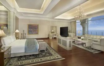 Deluxe suite with separate living room and sea view at the Waldorf Astoria Dubai Palm Jumeirah.