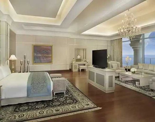 Deluxe suite with separate living room and sea view at the Waldorf Astoria Dubai Palm Jumeirah.