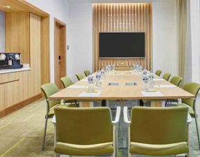 Meeting room with square conference table at the Hilton Garden Inn Dubai Mall of the Emirates.